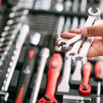 Store employee choosing wrench